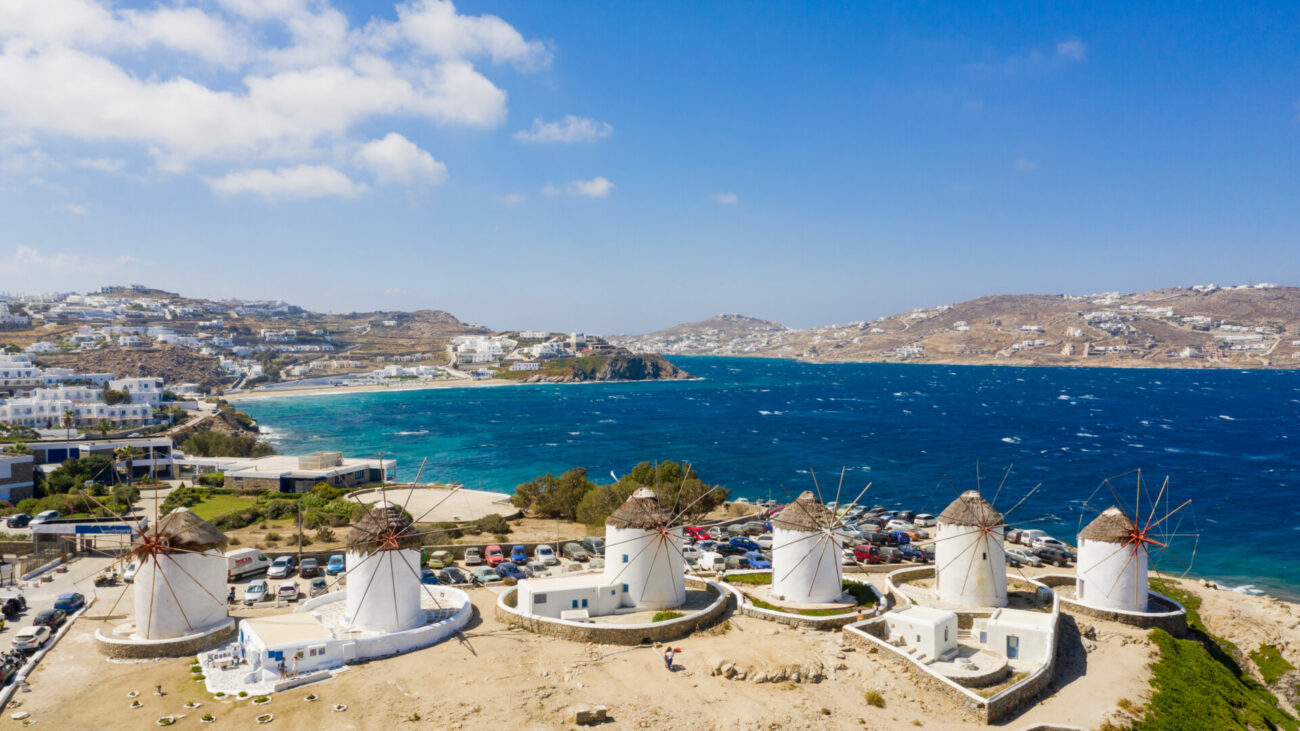 Mykonos windmills with a view of the Aegean Sea in Greece [Photograph] by Falco Ermert (dronepicr) - https://dronepicr.piwigo.com/picture?/8386/search/psk-20241127-NeNbjaybMS - Licensed under Creative Commons 2.0