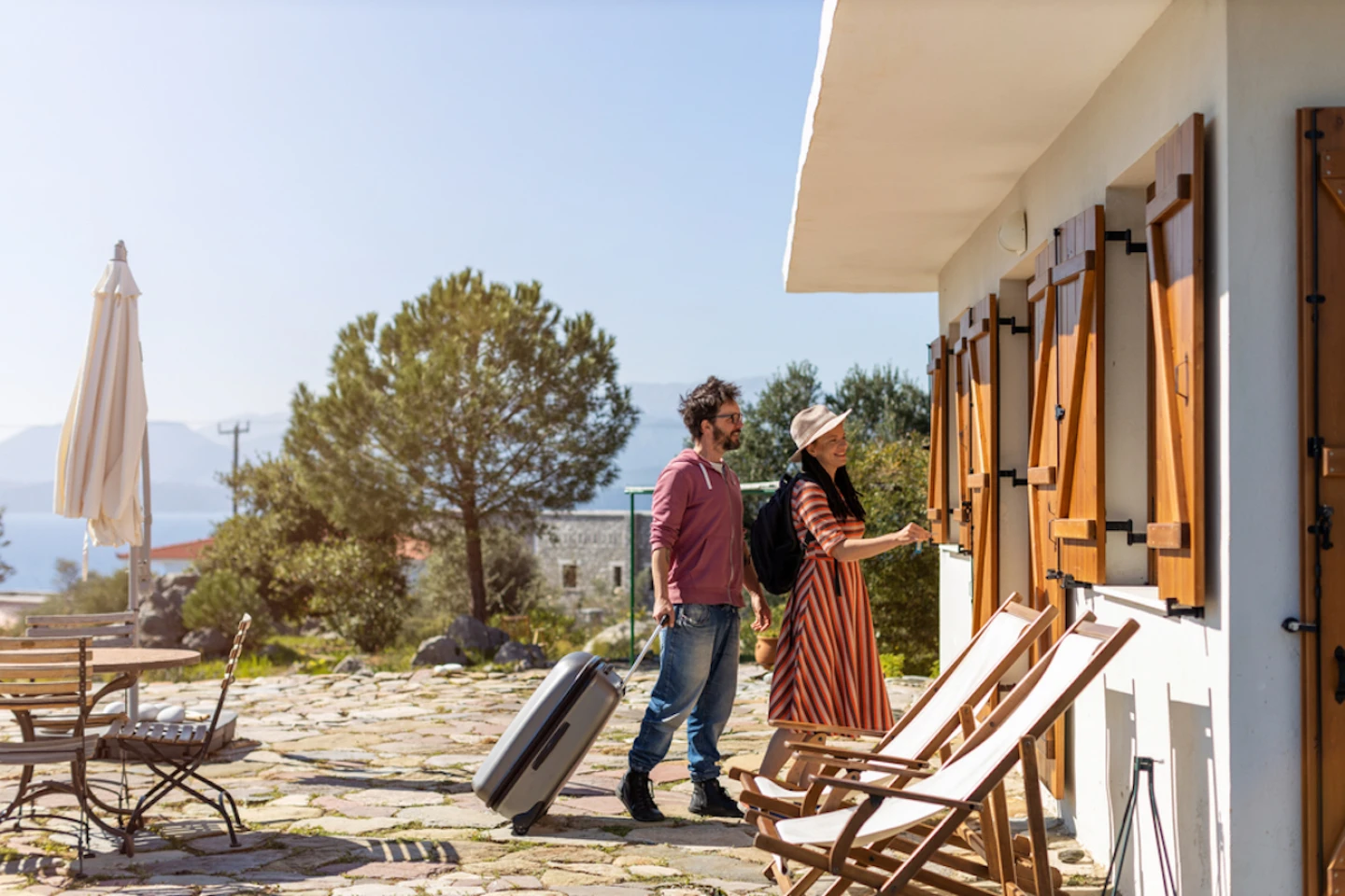 Young Couple Arriving to Holiday Home