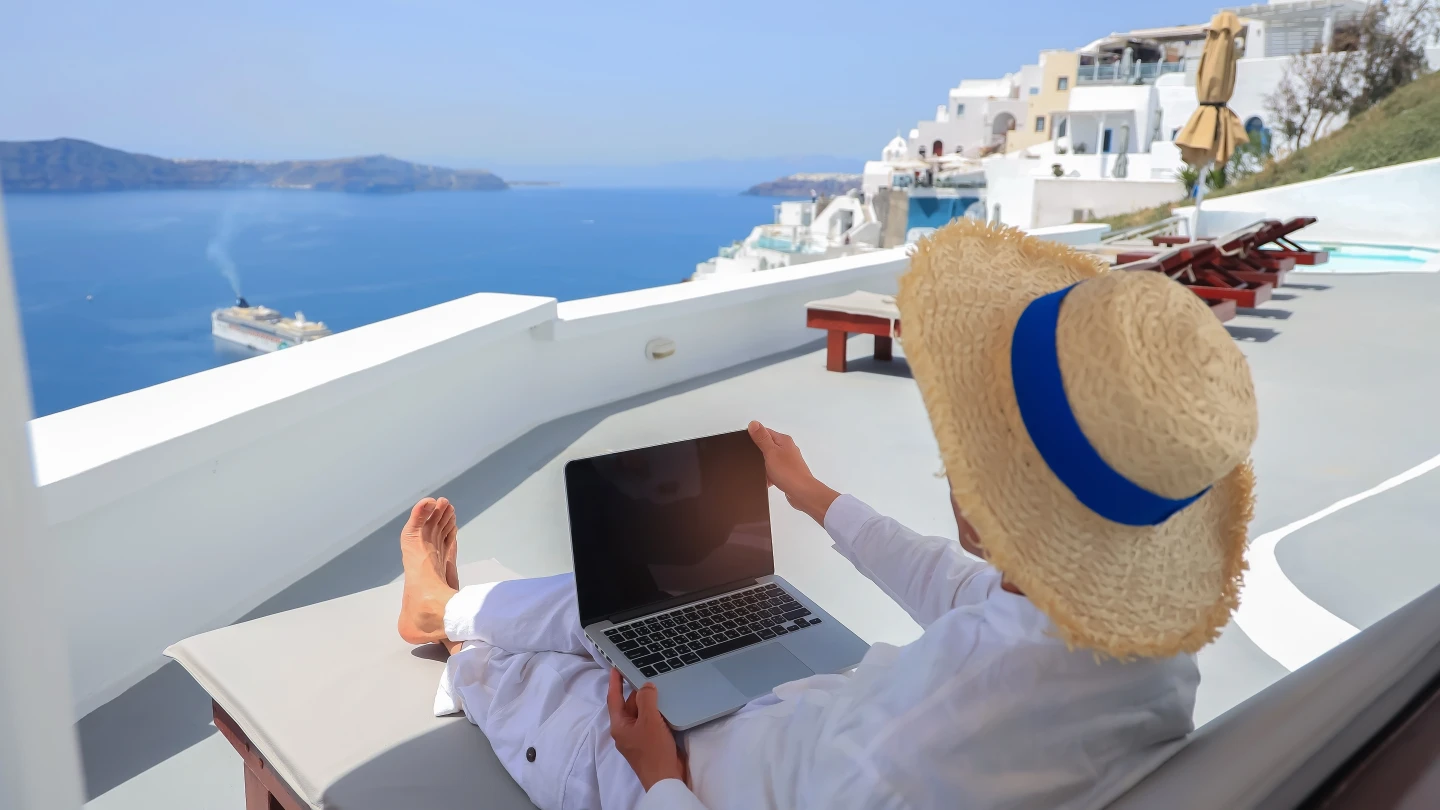 Expat working remotely in Greece with a sea view